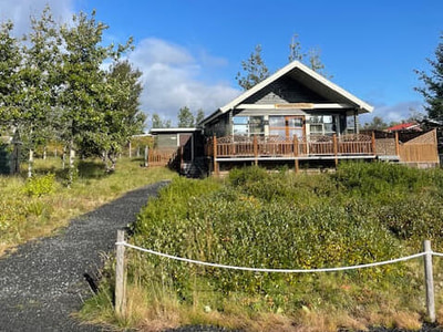 The holiday home Álftarstekkur has an inviting wooden terrace
