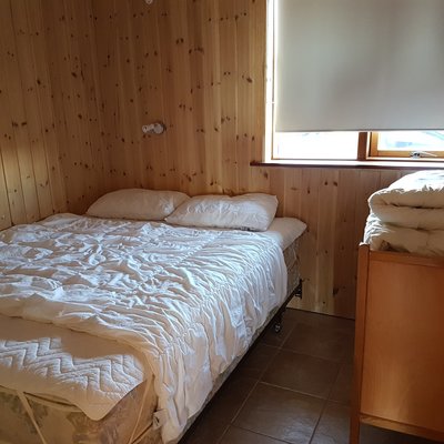 Bedroom with a double bed and a dresser