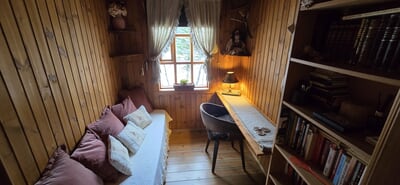 The sleeping sofa for two persons in one of the bedrooms