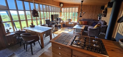 Stylish living-kitchen area with wood stove