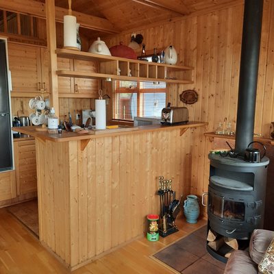 Well equipped kitchen and the fireplace