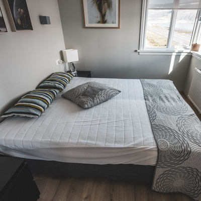 Comfortable bed with fjord view