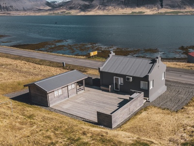 The cottage is situated by the fjord and has a large terrace at the rear