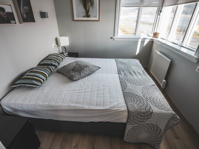 Comfortable bed with fjord view