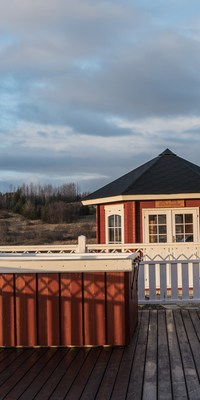 The private hot tub is located on the terrace and invites you to relax