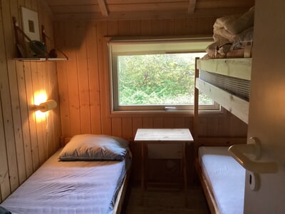 Bedroom with single bed, bunk bed and window