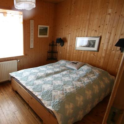 The large, comfortable bedroom with double bed and window