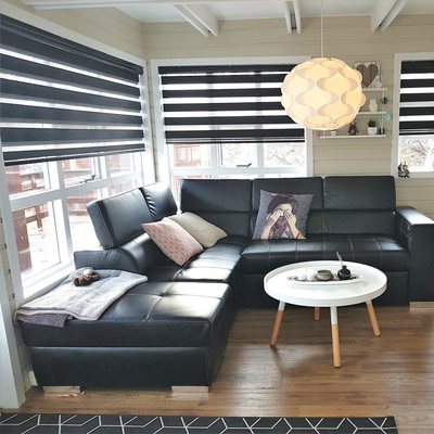 Stylish living room with leather furniture and flat screen.