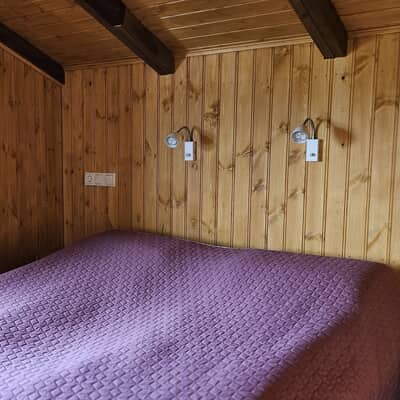 Space for tow: bedroom with double bed and narrow bunk bed
