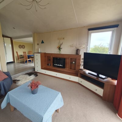 Living Room with electric fireplace, TV and WiFi
